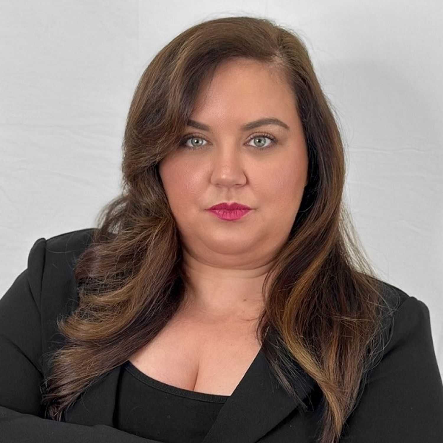Portrait of Amy, a professional stylist at ARIA Salon, showcasing their expertise and style.