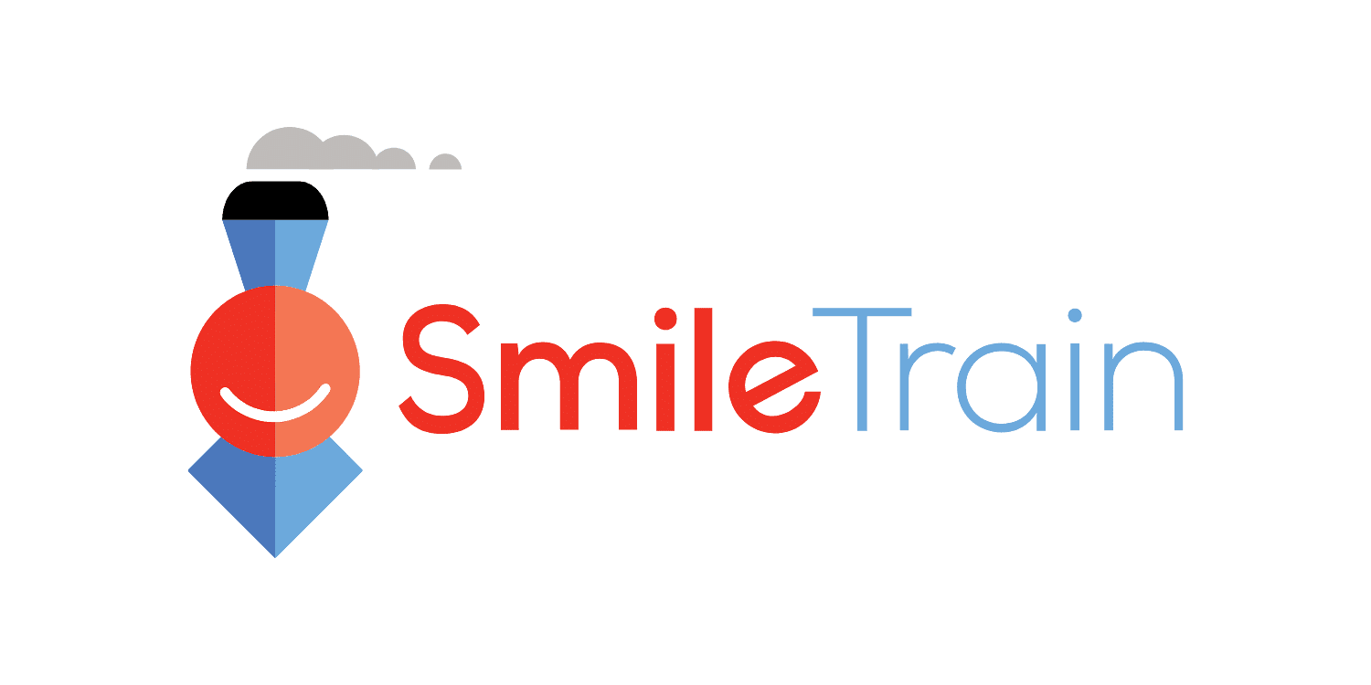 Smile Train logo featuring a smiling red face and blue train icon.