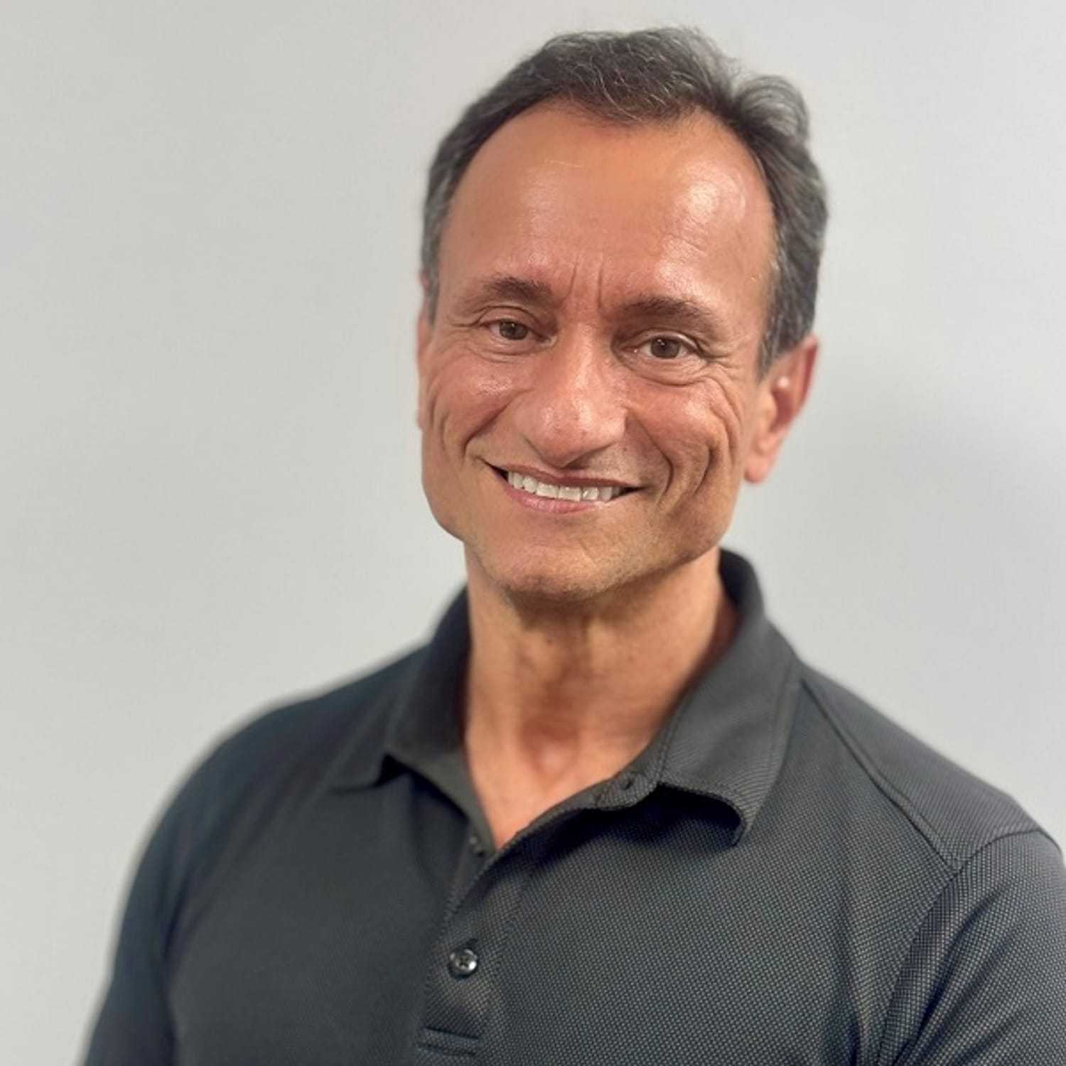 Portrait of Anthony, a professional stylist at ARIA Salon, showcasing their expertise and style.