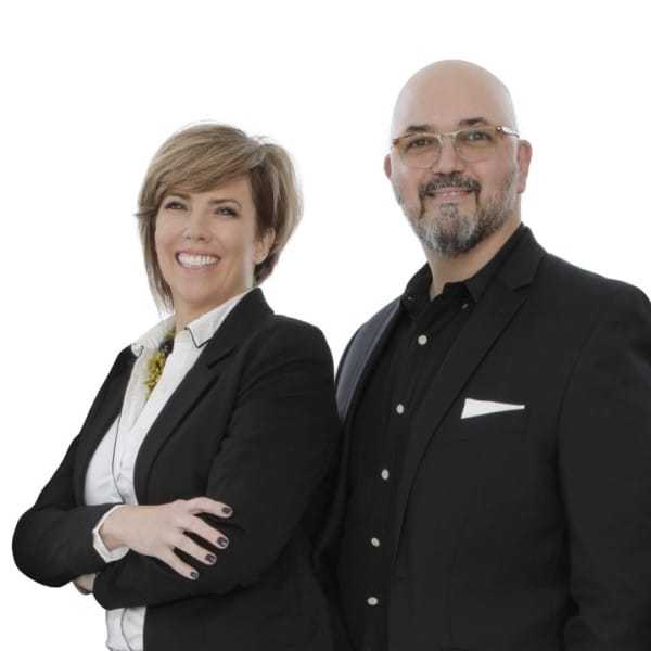 Portrait of Mechelle & Matthew, a professional stylist at ARIA Salon, showcasing their expertise and style.