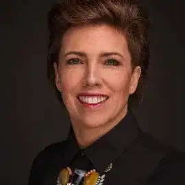Portrait of Mechelle, a professional stylist at ARIA Salon, showcasing their expertise and style.