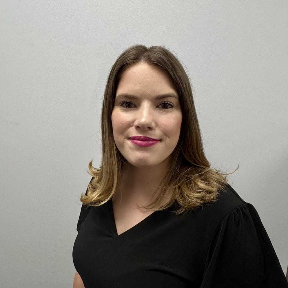 Portrait of Jaime, a professional stylist at ARIA Salon, showcasing their expertise and style.